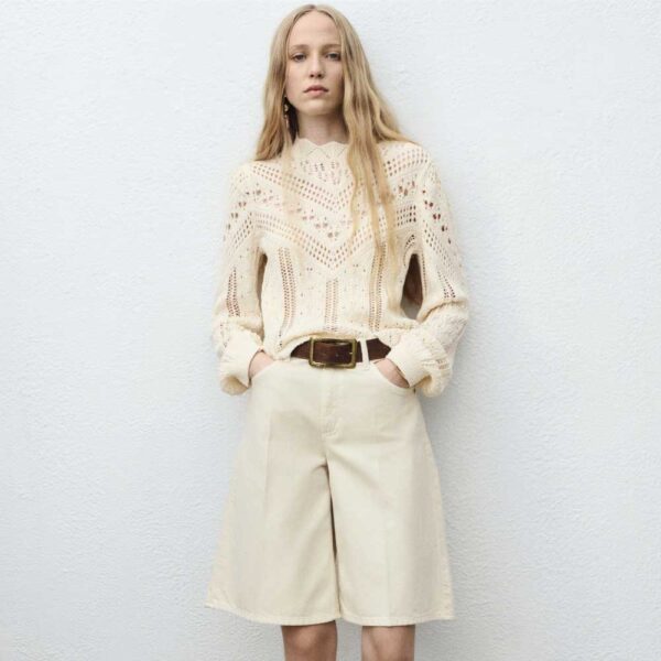 Knitted sweater with openwork details