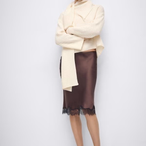 Ribbed sweater with scarf detail