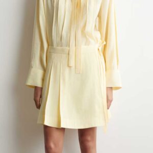PLEATED MINI WRAP SKIRT Butter yellow